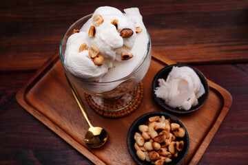 Coconut milk ice cream cup, round balls and young coconut Garnis
