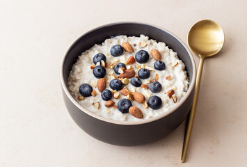 Oatmeal with blueberries, almonds and honey. Healthy food. Vegetarian food. Breakfast.