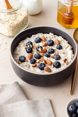 Oatmeal with blueberries, almonds and honey. Healthy food. Vegetarian food. Breakfast.