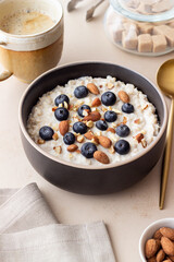 Oatmeal with blueberries, almonds and honey. Healthy food. Vegetarian food. Breakfast.