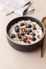 Oatmeal with blueberries, almonds and honey. Healthy food. Vegetarian food. Breakfast.