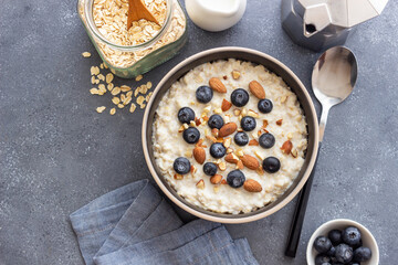 Oatmeal with blueberries, almonds and honey. Healthy food. Vegetarian food. Breakfast.