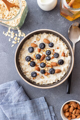 Oatmeal with blueberries, almonds and honey. Healthy food. Vegetarian food. Breakfast.