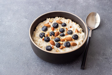 Oatmeal with blueberries, almonds and honey. Healthy food. Vegetarian food. Breakfast.
