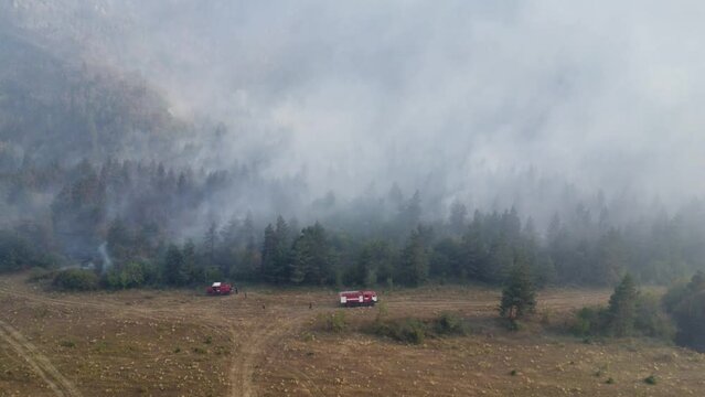 A fire engine is trying to put out the fire in the forest - Fire in Borjomi
