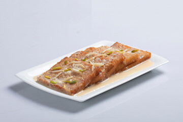 Delicious and creamy Shahi Tukrey (Bread Pudding).Shahi Tukda tukra dipped in Rabri or double ka meetha diwali sweet made with bread