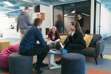 Multiethnic startup business team on meeting in a modern bright open space coworking office....