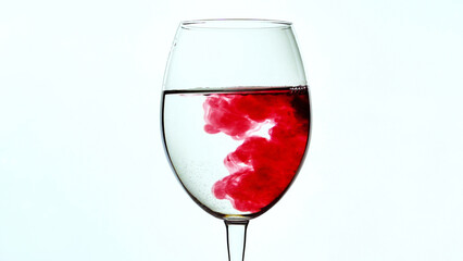Wine glass and spreading red ink. Red wine fill the bowl