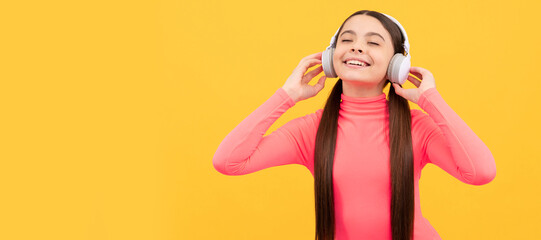 online education. webinar. back to school. kid listen to music in headphones. Child portrait with headphones, horizontal poster. Girl listening to music, banner with copy space.