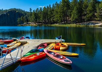 Small Boats and Pier With Lenker Rock Across Legion Lake,. Custer State Park, South Dakota, USA