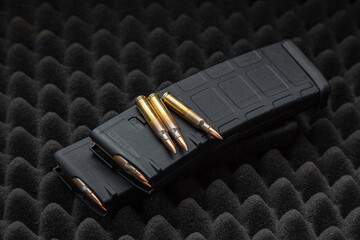 Cartridges and clips for a rifle or carbine. Ammunition for weapons. Ammunition for weapon lies on...