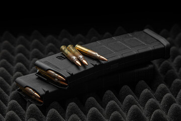 Cartridges and clips for a rifle or carbine. Ammunition for weapons. Ammunition for weapon lies on...