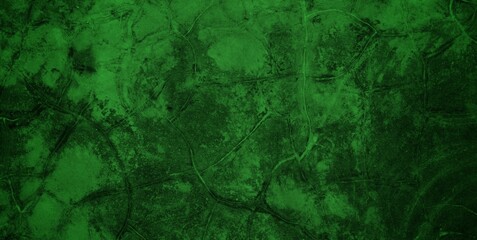 A textured green grunge background with dark patches and rough surface