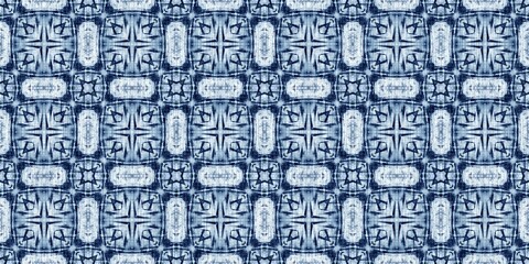 Fototapeta premium Indigo dye wash coastal damask seamless border pattern. Washed out geometric dip dyed blur effect edging. Nautical and marine ocean blue masculine endless tape background with linen texture trim.