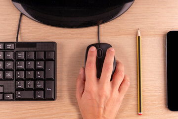 hands clicking  on mouse, pensil, keyboard on the desk