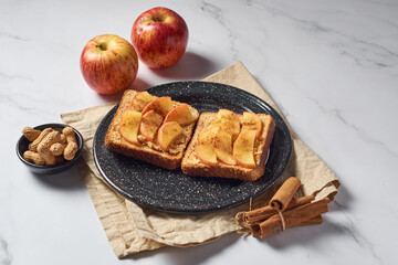 Toasted bread with peanut butter and apple. Quick and healthy breakfast ideas.