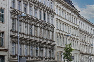 Facade of historical buildings in the old town of Vienna, Austria, Central Europe. Ornaments and patterns of white houses, architectural background.