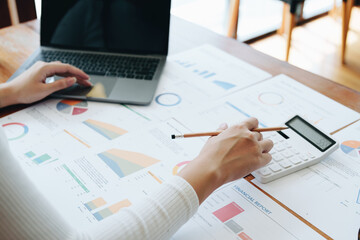 Accountants, Asian auditors are using calculators and computers to review annual tax budgets to submit information to the IRS.