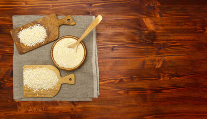 White sesame seeds, sesame seeds on an old rustic background close-up. Flat lay. Copy space