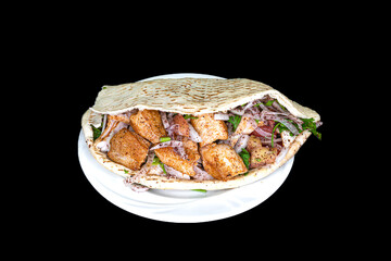 Chicken Skewers in pita bread in a white plate on a black background