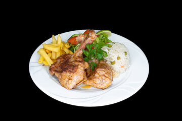 Grilled chicken chops in a white plate on a black background