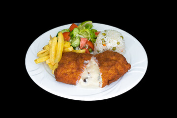 Fried stuffed chicken in a white plate on a black background