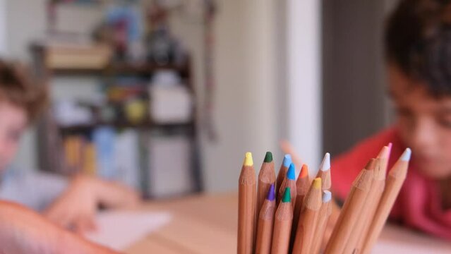 children drawing writing with colored pencils at home concept education at home back to school childhood education