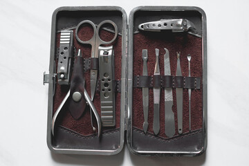 Manicure nails and pedicure tool set concept, cosmetic accessories for nails, scissors, pusher...