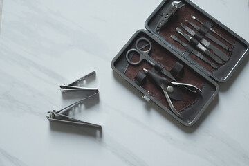 Manicure nails and pedicure tool set concept, cosmetic accessories for nails, scissors, pusher...