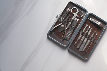 Manicure nails and pedicure tool set concept, cosmetic accessories for nails, scissors, pusher cuticle and nail file, cleaning nails for protection dirt bacteria in nails