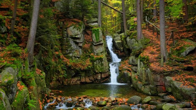 Nature landscape. Waterfall. Beautiful fall mountain wild Forest waterfall with green moss covered stones. Forest autumn landscape. Scenery of nature. Video 4k