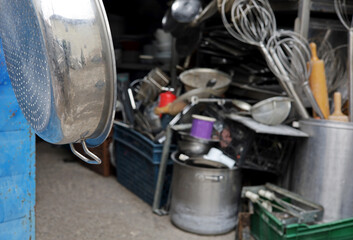 set of used old kitchen utensils in second hand vintage shop