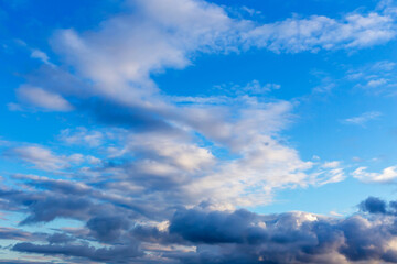 Naklejka na ściany i meble Dark and white clouds in the blue sky
