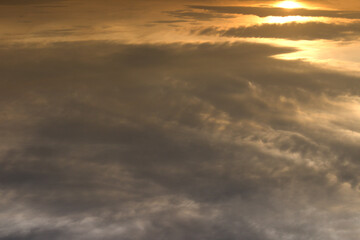 This shot as the morning sun rises above the clouds is ideal as a background and texture.