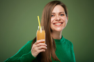 Smiling and happy woman holding orange juice bottle. Isolated advertising female portrait.