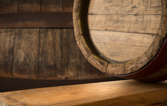 Old wooden barrel on a brown background. High quality photo