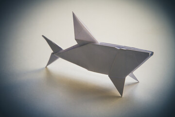 Paper shark origami isolated on blank background