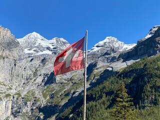Summer day blue sky mountains landscape. Nature landscape with sun and blue sky. Summer travel in Europe mountains. Nature, lake, forest, trees hiking path. Clouds on blue sky. Forest landscape hiking