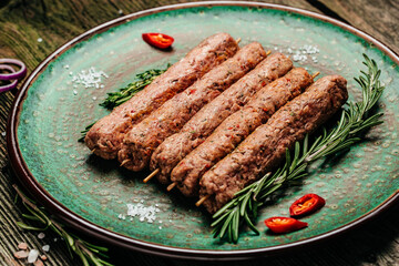 Fresh Raw Beef Minced Meat on a wooden board. Food recipe background. Close up. top view. place for text