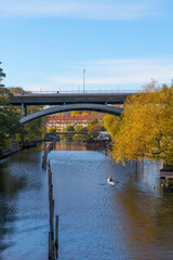 Fototapeta na wymiar Bridges over the canal Pålsundet, canoer, a sunny color full autumn day in Stockholm