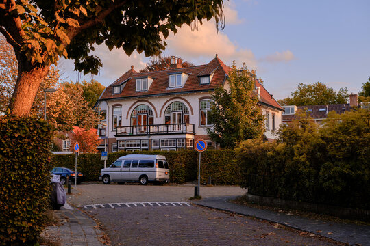 Bussum, The Netherlands - October 11, 2022. Beautiful villa in residential area bathed in warm autumnal sunshine.