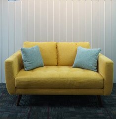 yellow sofa in a room, set for interior decoration