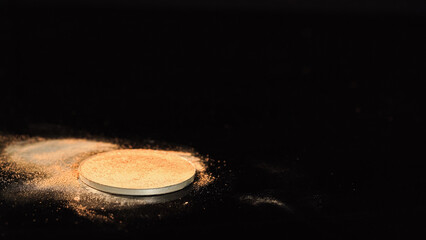 Face powder on black surface with copy space