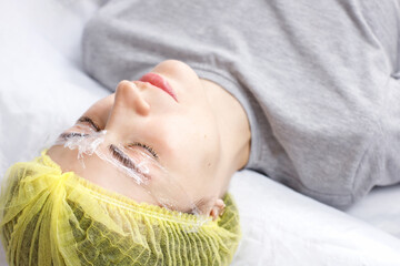 woman undergoing eyelash lamination procedure