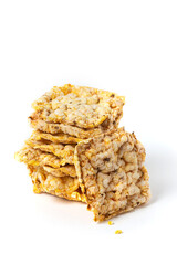 Stack of whole grain crusty bread. Snacks made of air wheat or air grain on a white background