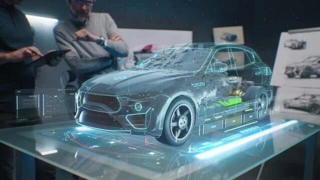 Car design engineers using holographic app in digital tablet. Develop modern innovative high-tech cutting edge eco-friendly electric car with sustainable standards. They test the aerodynamic qualities