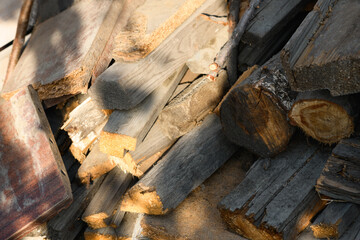 Stocks of wooden firewood close-up. Preparing for winter, world energy crisis