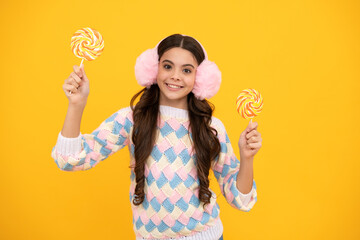 Hipster teenager child girl lick lollypop. Sugar nutrition, candy and sweets. Child eat lollipop popsicle.