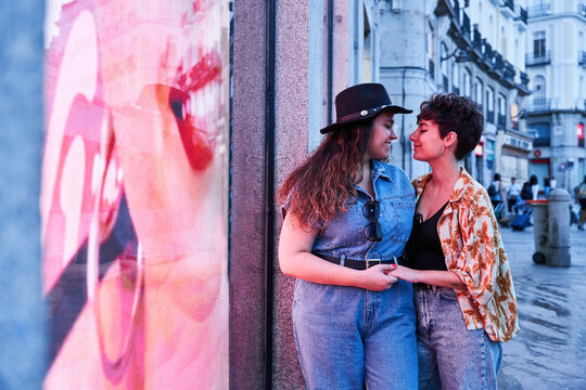 Lesbian couple during romantic date on street in evening