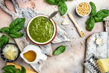 pesto sauce with ingredients Basil, olive oil, parmesan, garlic, pine nuts. banner, menu, recipe place for text, top view